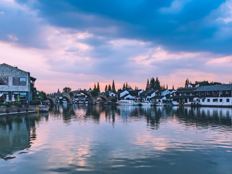 3 Days in Shanghai Itinerary: First-Timer Route + Neighborhood Walks 3 3 days in Shanghai itinerary - Zhujiajiao Water Town sunset with fiery clouds